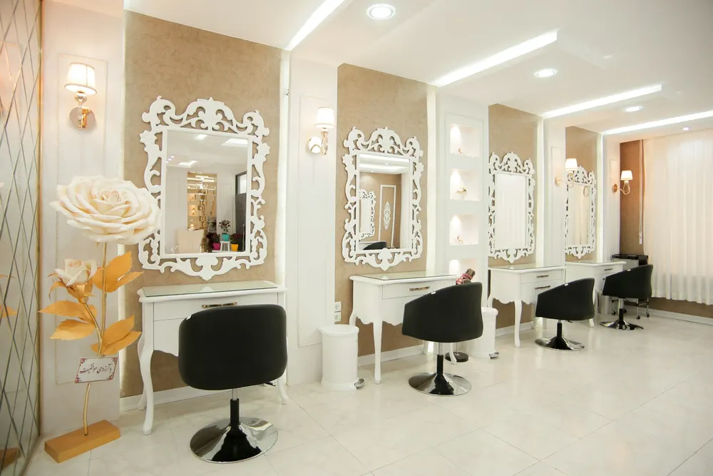 A salon interior with chairs and mirrors